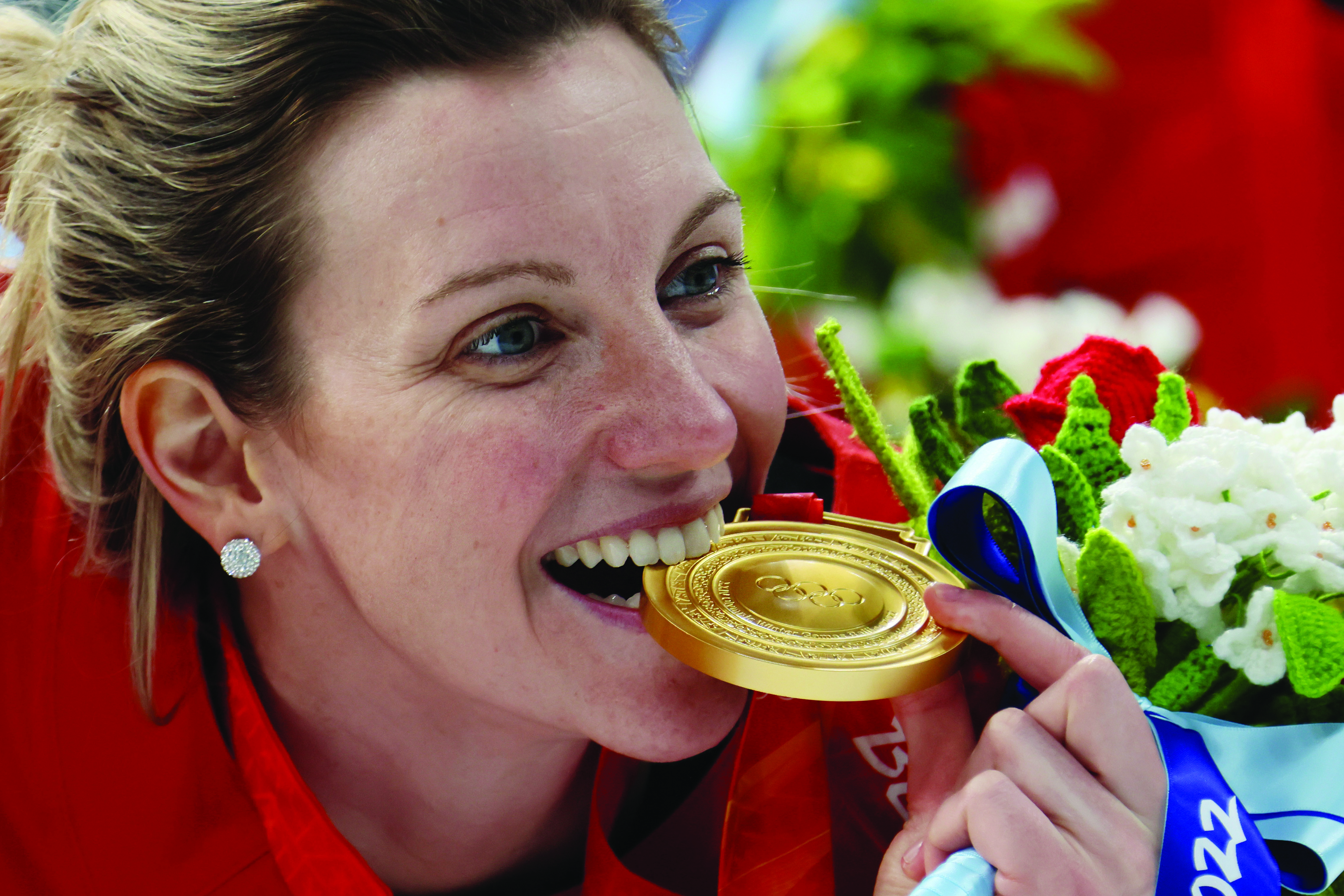 Woman biting medal