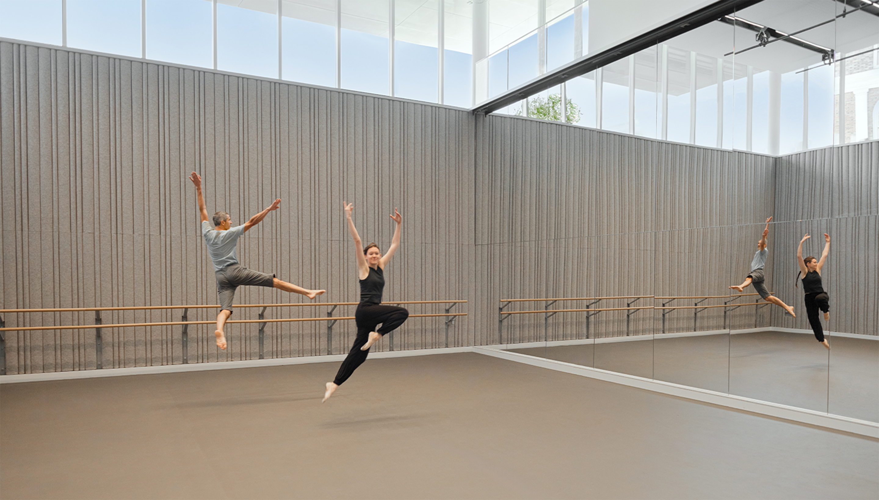 Two people dancing in studio.