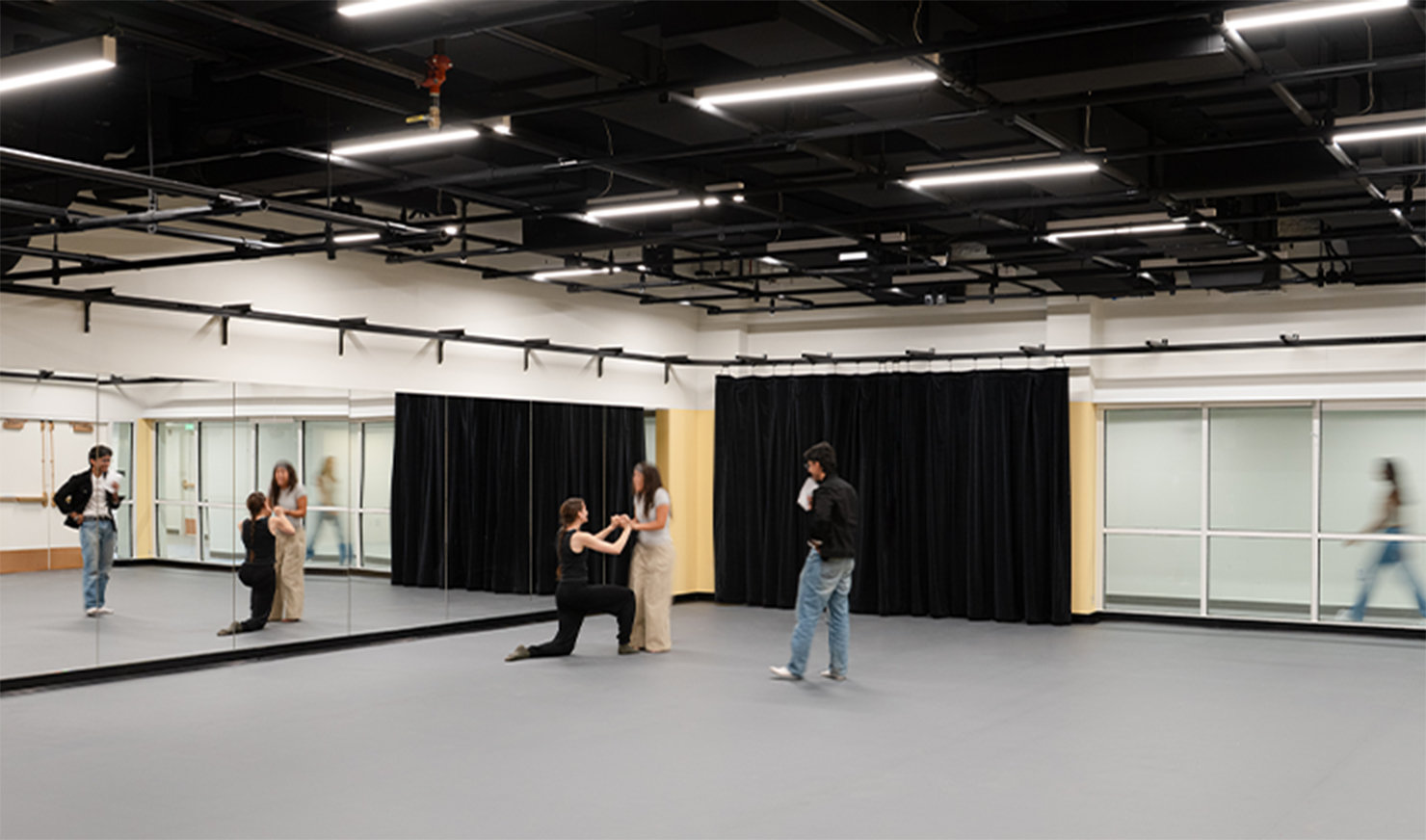 Students acting in black box theater