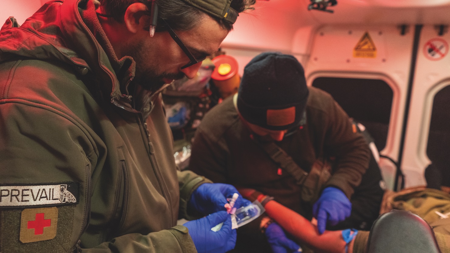 EMTs working on patients