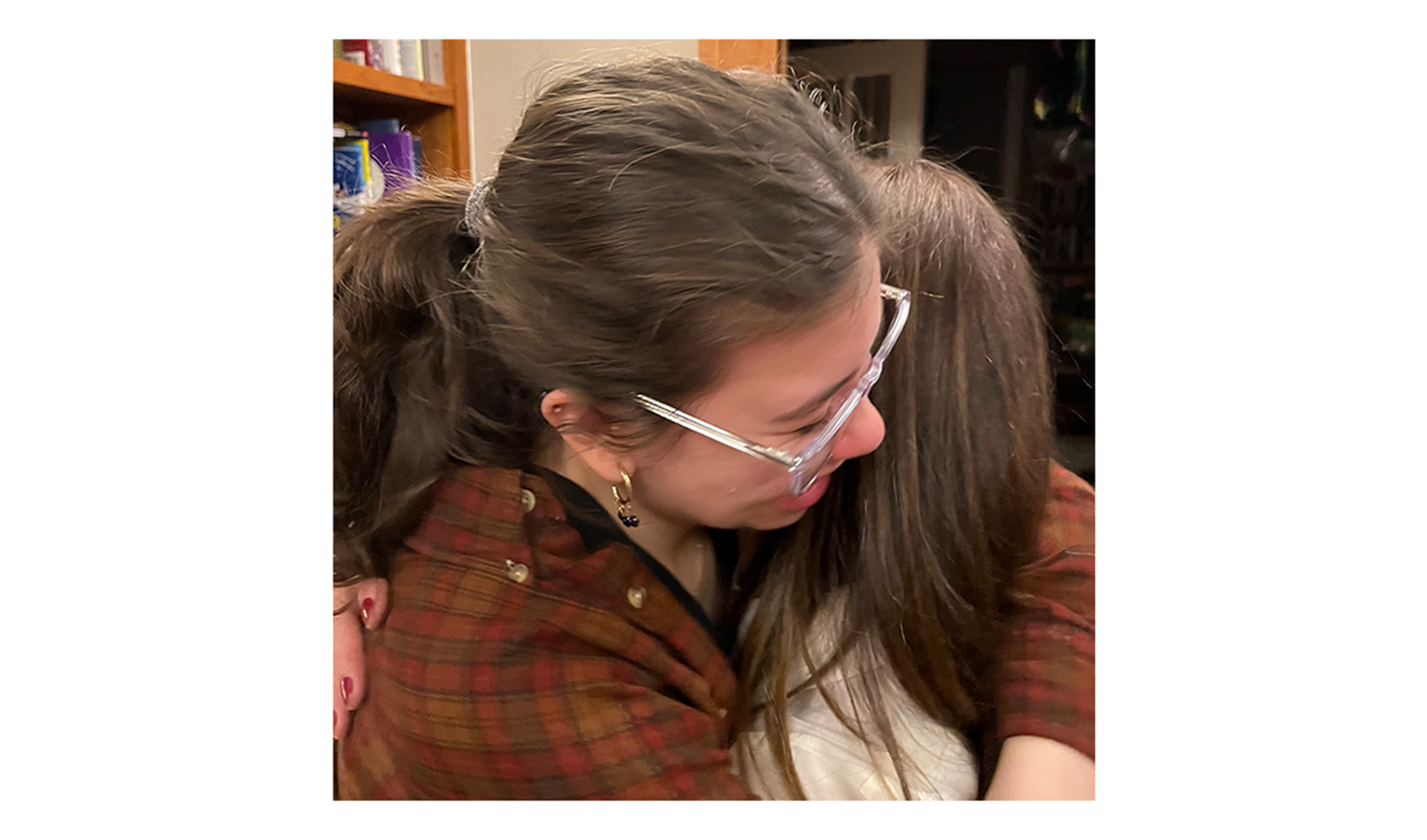 Mom hugging daughter