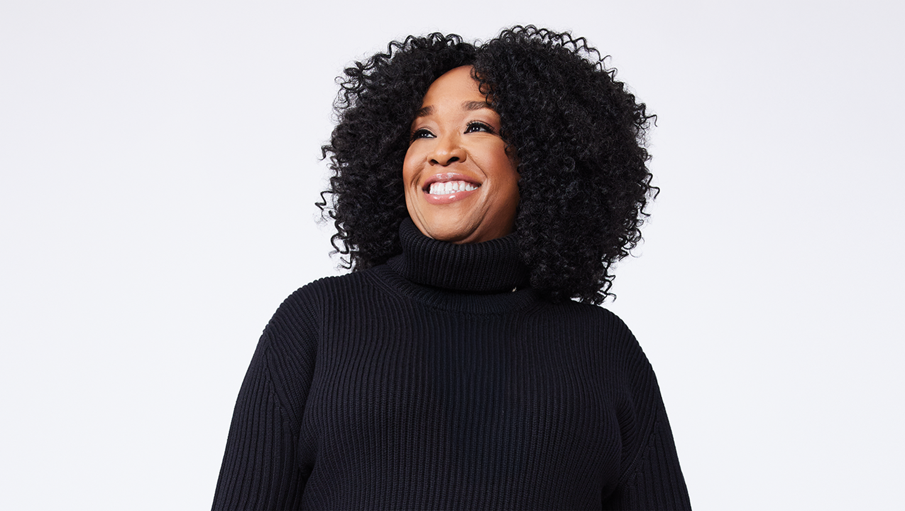 Headshot of a woman wearing black sweater