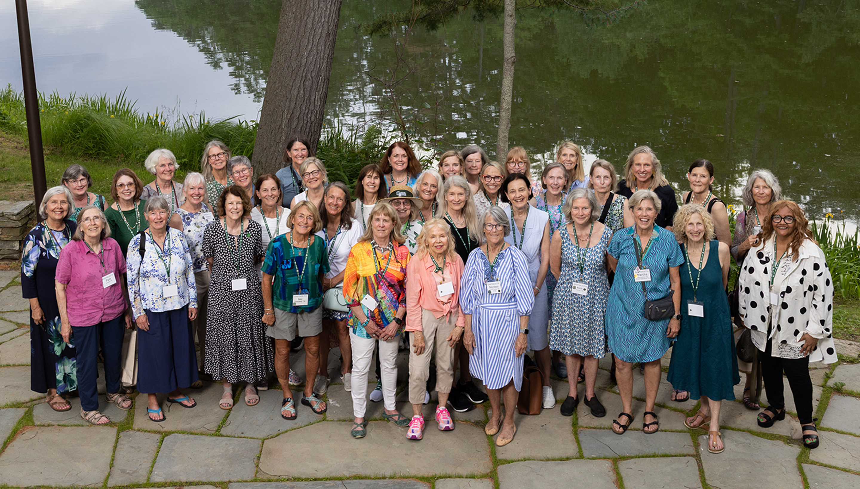 Women posing in front of river