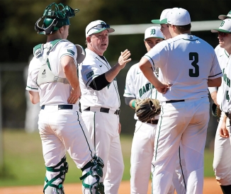 Baseball coach talking to team