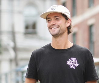 Headshot of man standing on city street