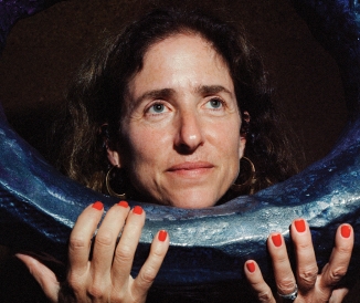 Woman posing with art sculpture