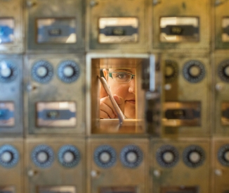 Person looking out of mailbox