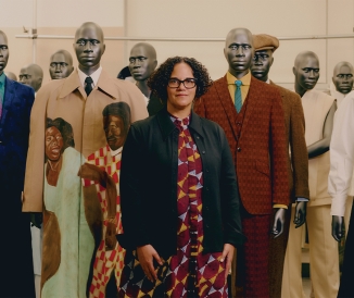 Woman standing in front of mannequins