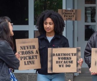 Students holding protest signs