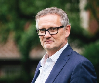 Headshot of man wearing glasses