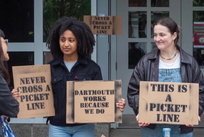 Students holding protest signs