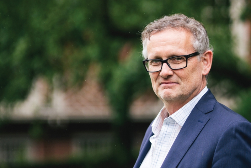 Headshot of man wearing glasses