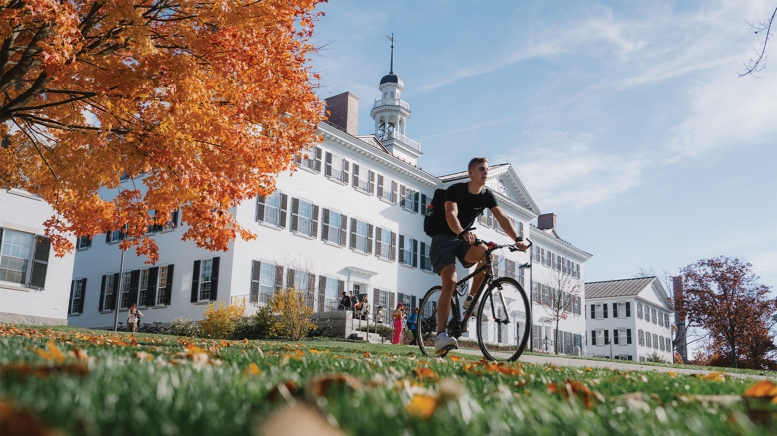 Man on bike on campus