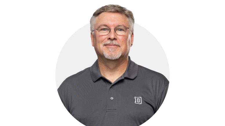 Headshot of man wearing collared shirt
