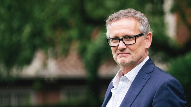 Headshot of man wearing glasses