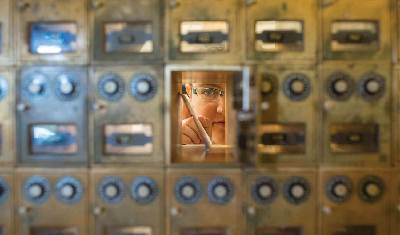 Person looking out of mailbox