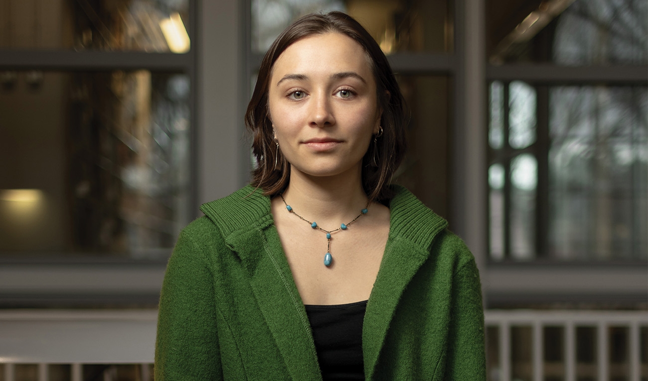 Headshot of woman wearing green sweater