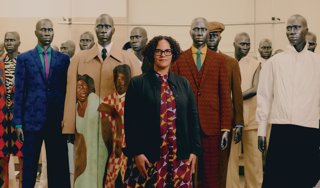 Woman standing in front of mannequins