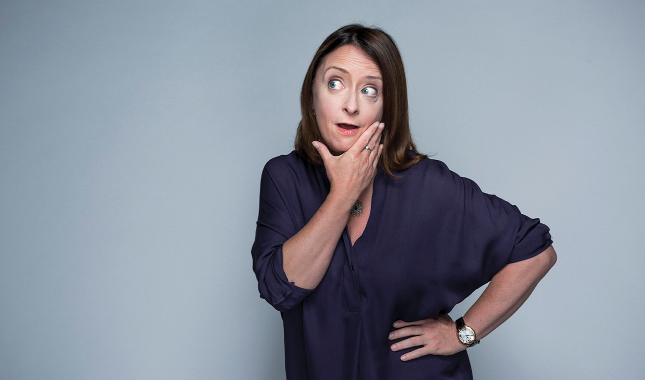 Woman posing with hands on chin and hip