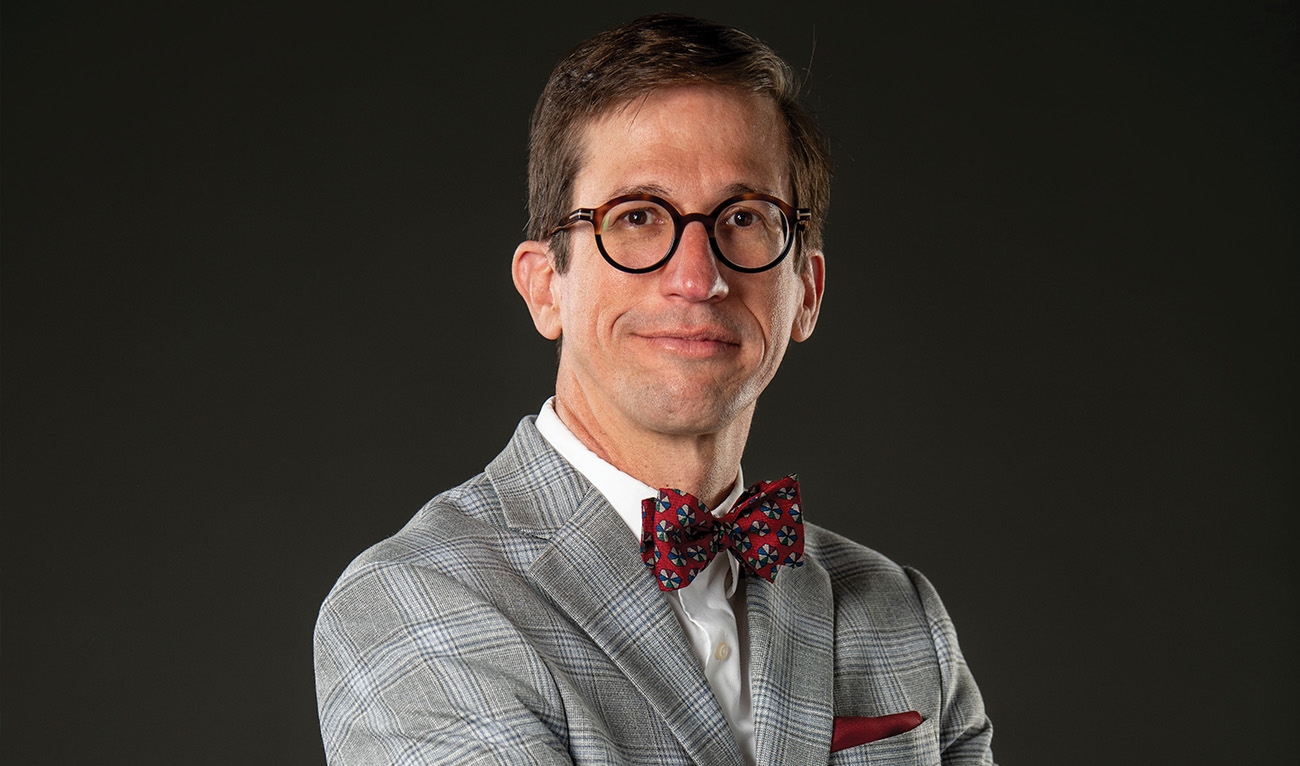 Man wearing glasses and bowtie