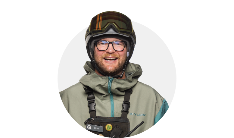 Man wearing ski goggles on head