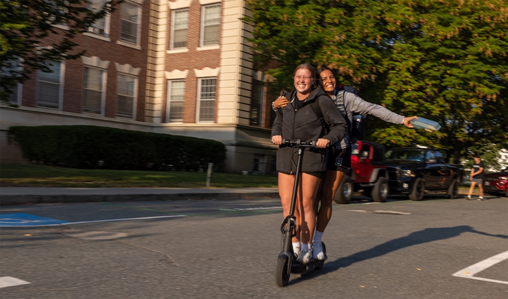 Two women on an e-scooter