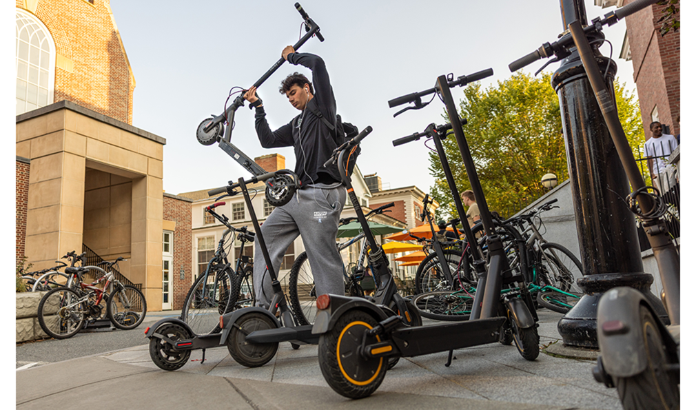 Man holding up e-scooter