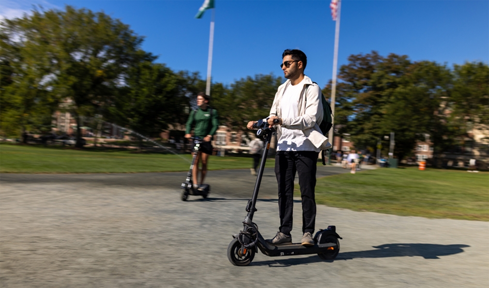 Two men on e-scooters