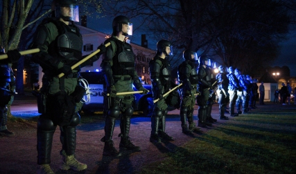 Riot police with batons