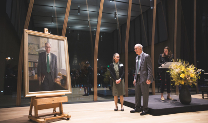 People standing in front of painting