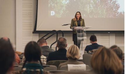 Person speaking to audience