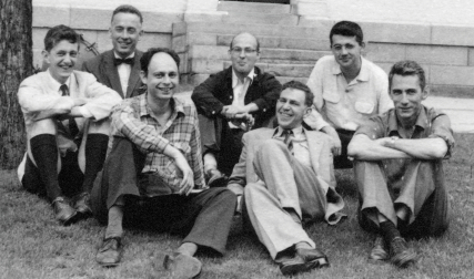 Group of men sitting on ground