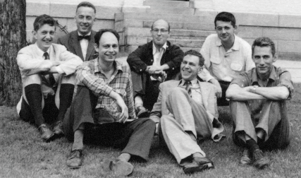 Group of men sitting on ground