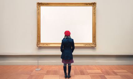 Woman standing in front of blank canvas