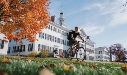 Man on bike on campus
