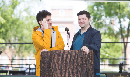 Two men standing at podium