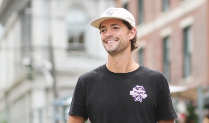 Headshot of man standing on city street