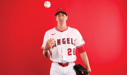 Pitcher tossing baseball