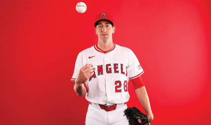 Pitcher tossing baseball