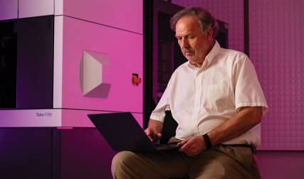 Man typing on laptop