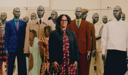 Woman standing in front of mannequins