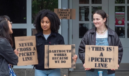 Students holding protest signs