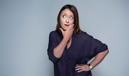 Woman posing with hands on chin and hip