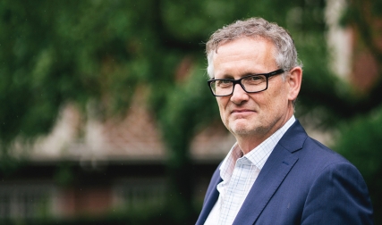 Headshot of man wearing glasses