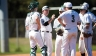 Baseball coach talking to team