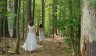 Two women walking in woods